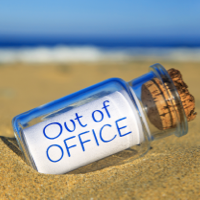 Message in a bottle with a message saying out of office